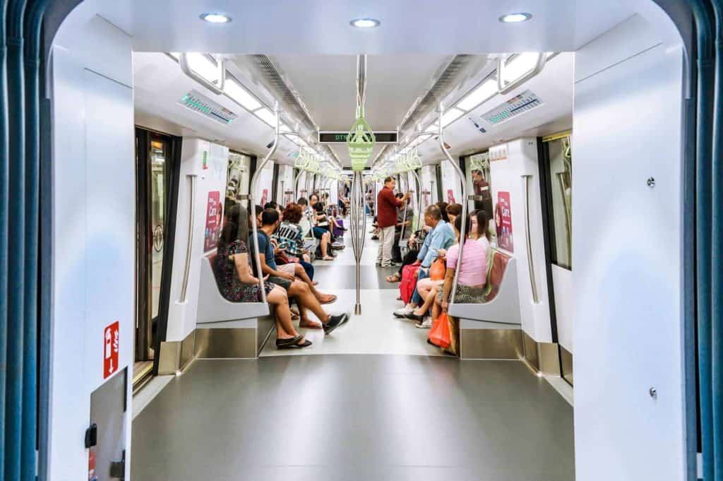 5 days in singapore itinerary - One of the MRT trains filled with seated passengers in Singapore
