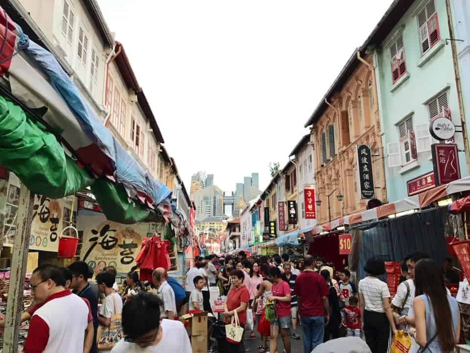itinerary for singapore 5 days - the lively environment in  Chinatown during Chinese New Year with the main streets filled with people