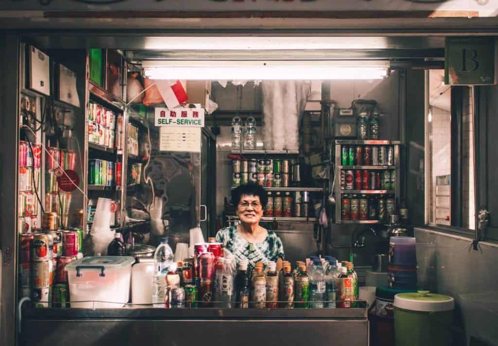 singapore 5 days itinerary - a lady posing at her drink stall