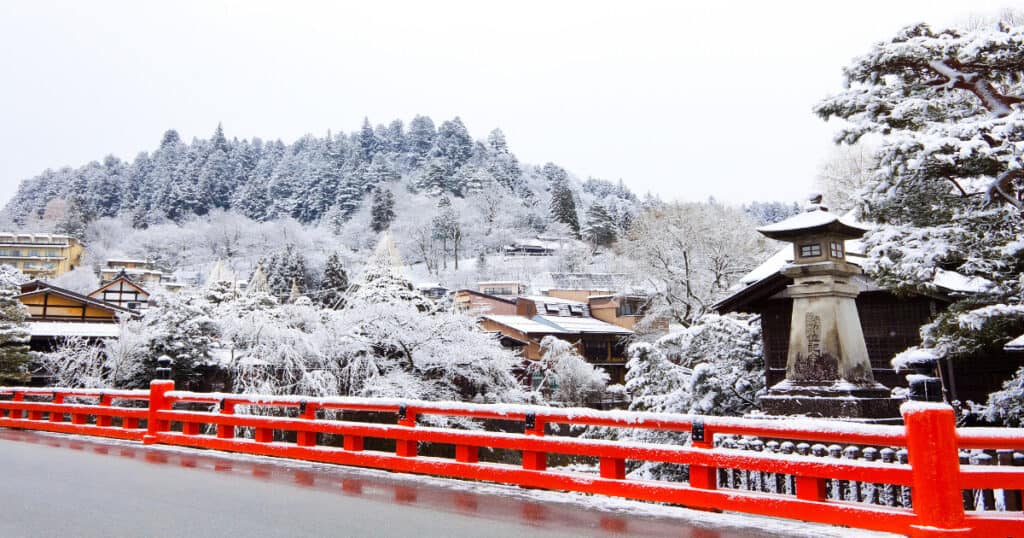 takayama winter old town - the snow covering the trees and roofs near Nakabashi Bridge of Takayama