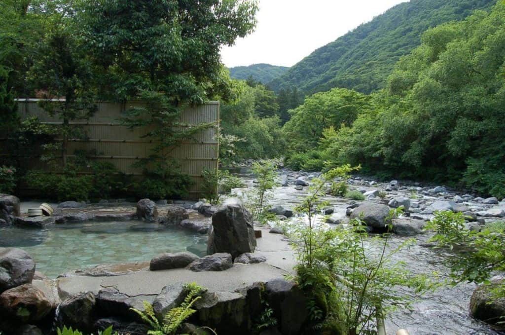 best ryokan in hakone with private onsen - the beautiful open-air onsen in Kijitei Hoeiso situated next to a river