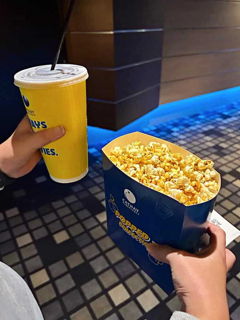singapore date ideas - enjoy a movie date while munching on popcorns