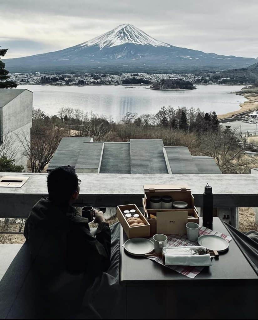 three weeks in japan itinerary - a guy overlooking Mt Fuji from at Hoshinoya Fuji