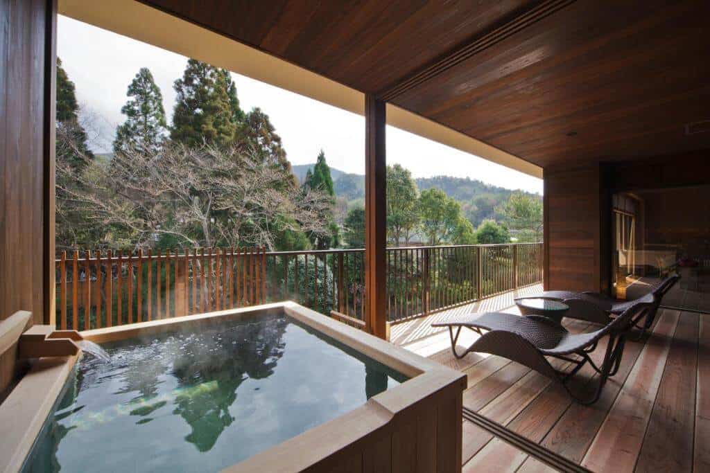 kyoto ryokan with private onsen - an open-air bath facing lush greenery at Kyo Yunohana Resort Suisen