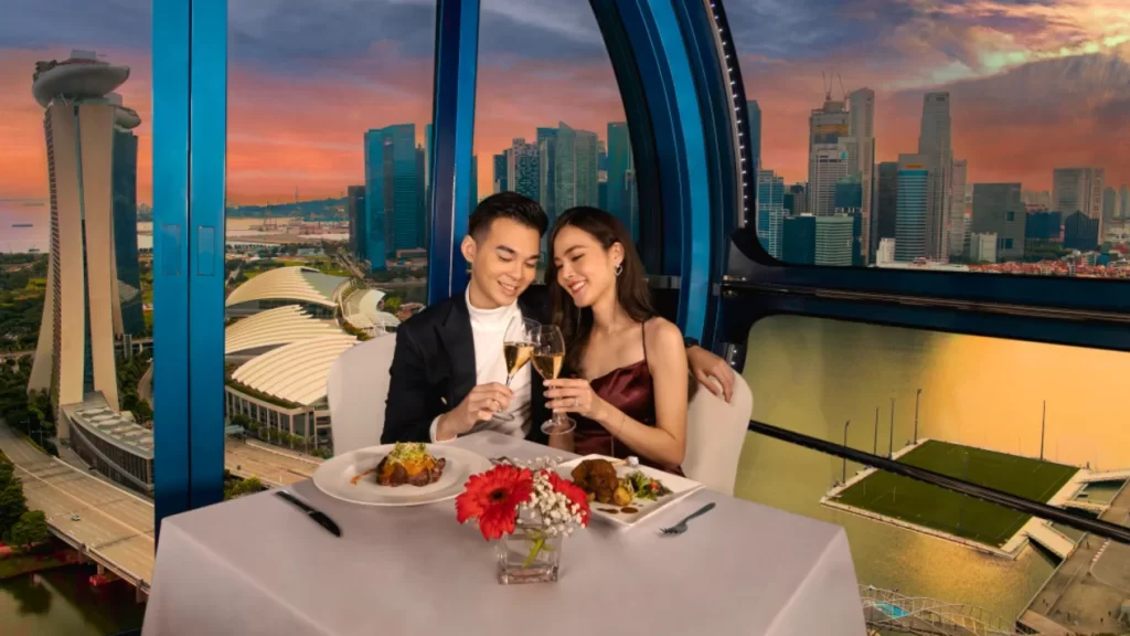 date night ideas singapore - a couple is enjoying their romantic dinner at 165 Sky Dining