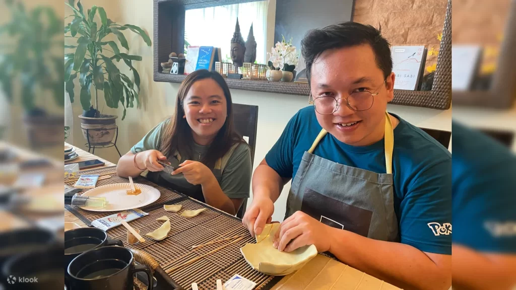 first date ideas singapore - a couple work together to mend the broken bowl pieces during the Kintsugi Workshop