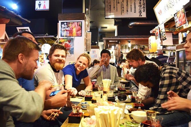 kyoto food tours - a group of participants enjoying drinking sake