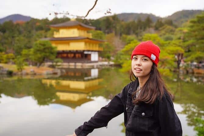 kyoto photography tours 3 - a lady posing in front of Kinkakuji