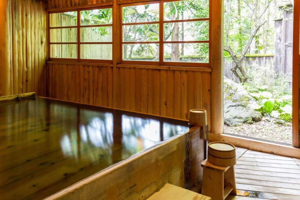 ryokan with private onsen takayama - one of the indoor hot spring baths in Kazeya