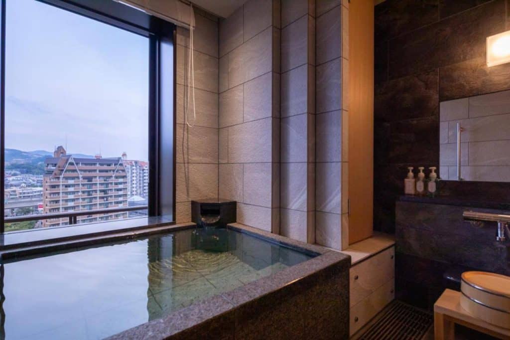 osaka hotel with private onsen -the private onsen bath inside a room at Hotel Wakamizu