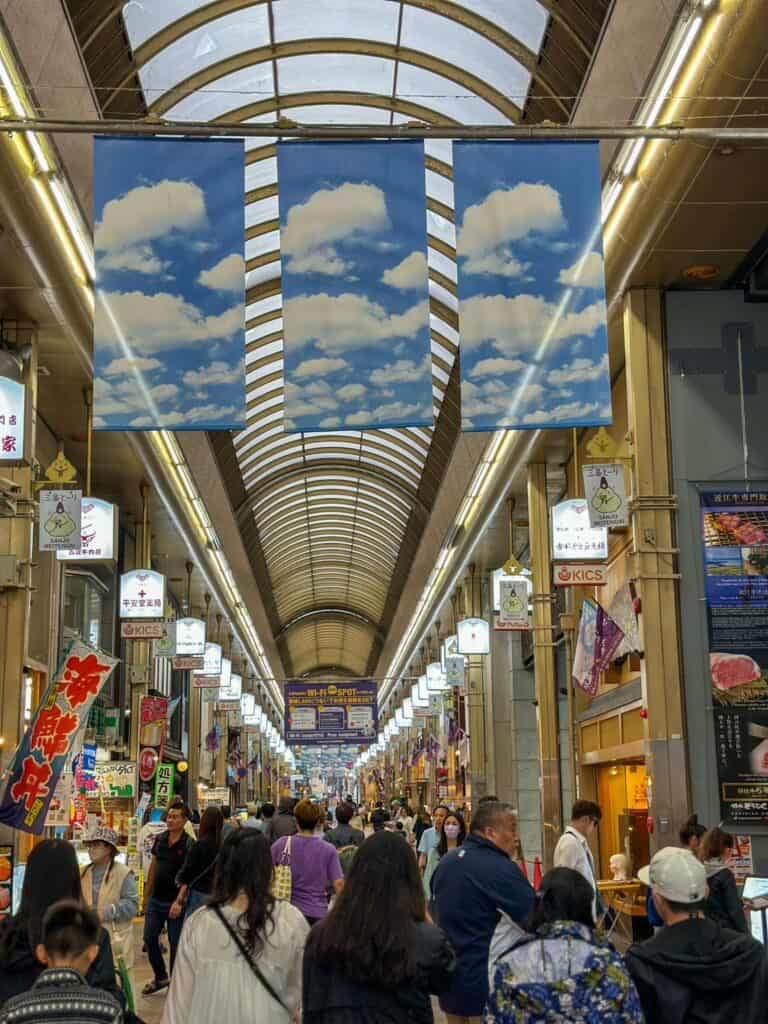things-to-do-at-night-in-kyoto - a large crowd walking along the Teramachi Shopping Arcade in Kyoto