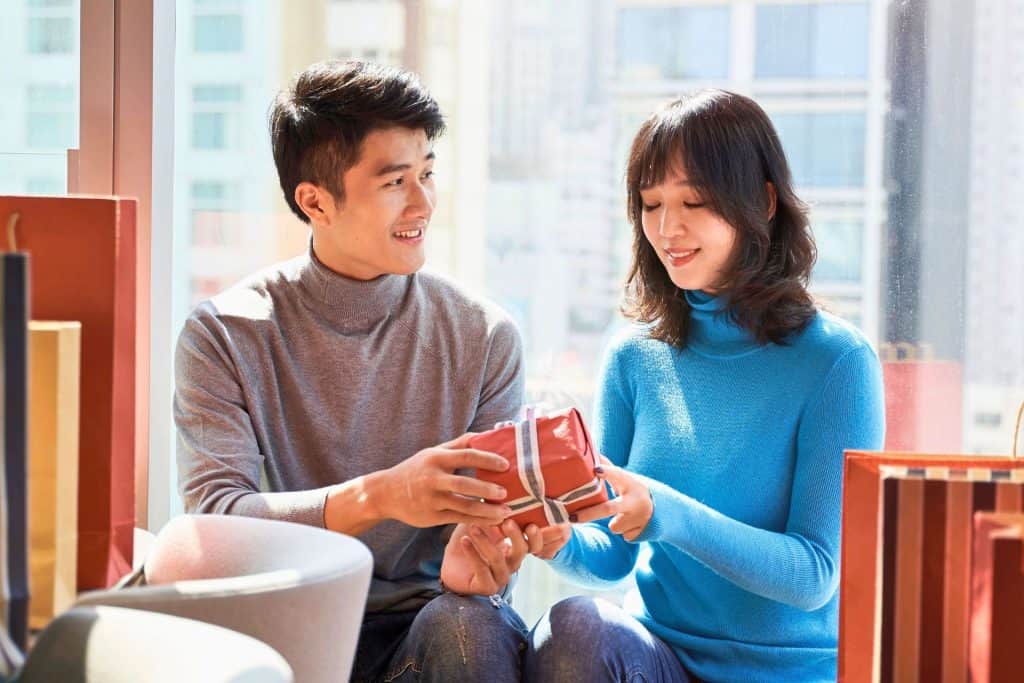 best gift ideas for japan lovers - a guy gives a present to a lady