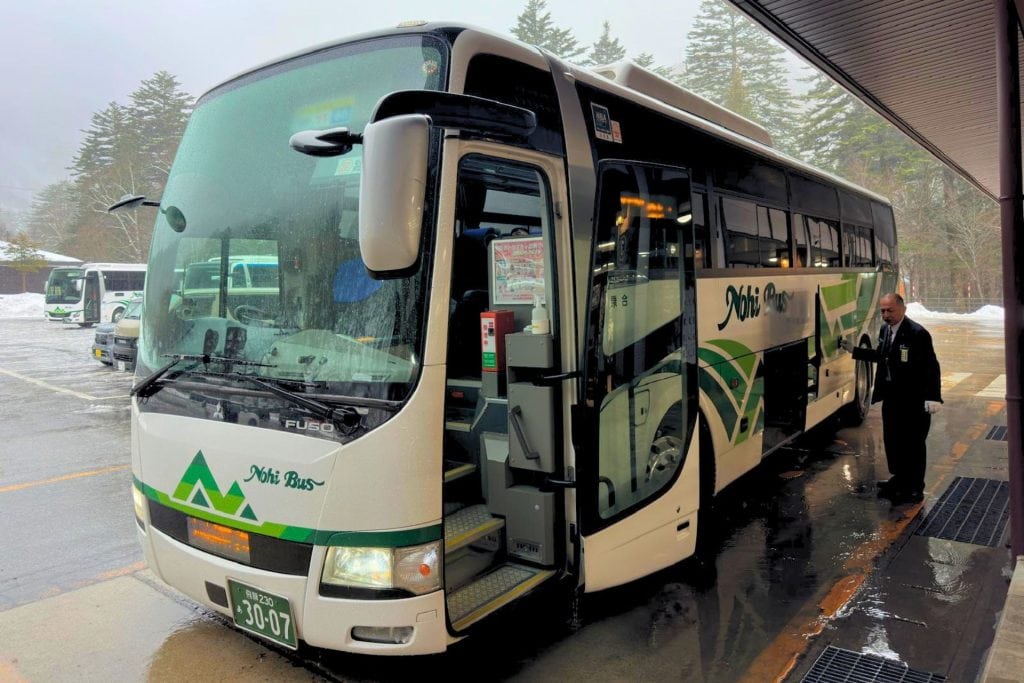 how to travel in japan without jr pass - a Nohi bus is parked at the Hirayu Onsen Bus Terminal